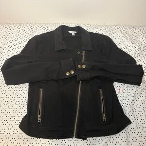 Black jacket with gold buttons and zippers.